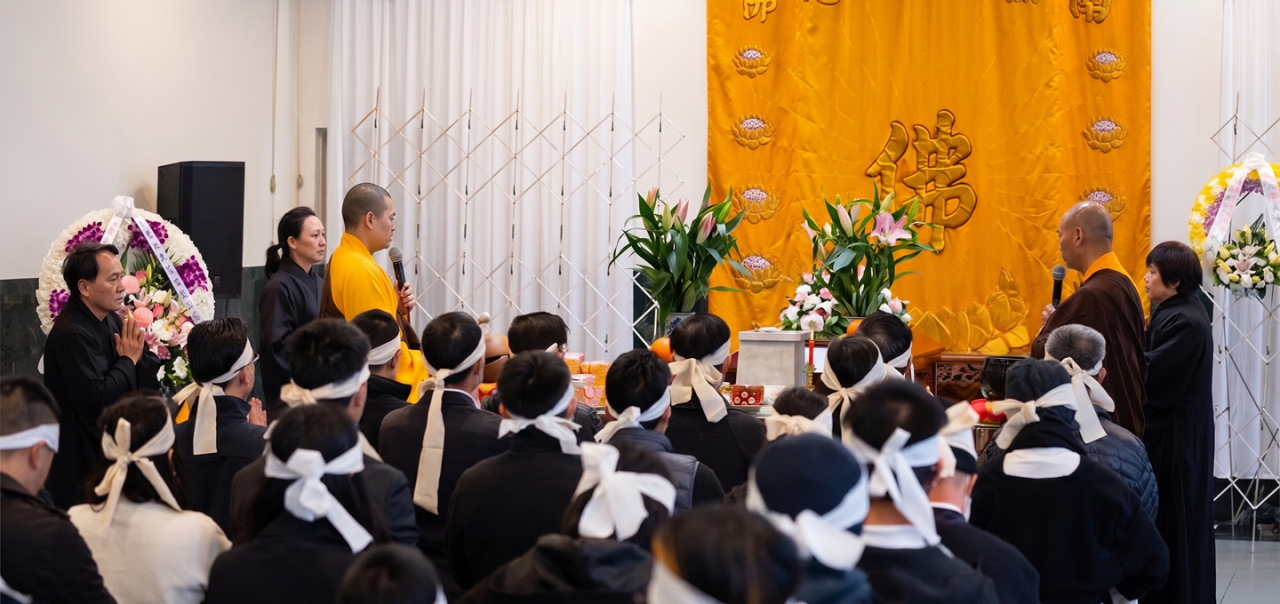 buddhist monk conducting memorial service