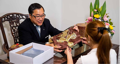 Universal Chung Wah funeral director helping a woman