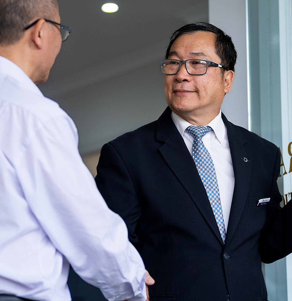 Universal Chung Wah funeral director greeting a man
