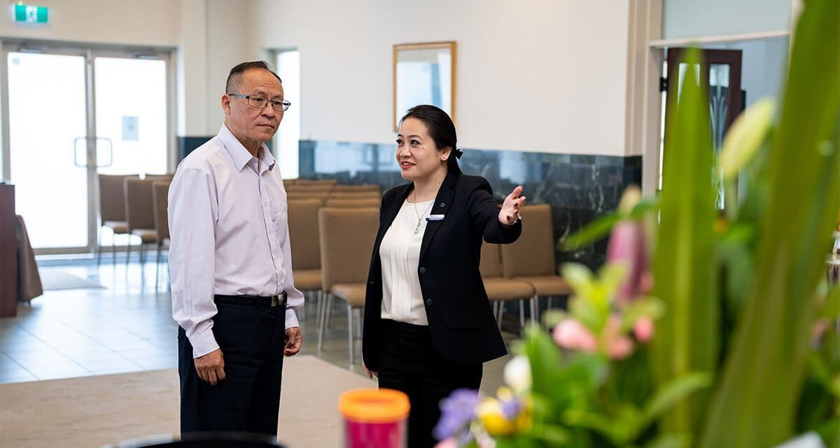 Universal Chung Wah funeral director helping a man