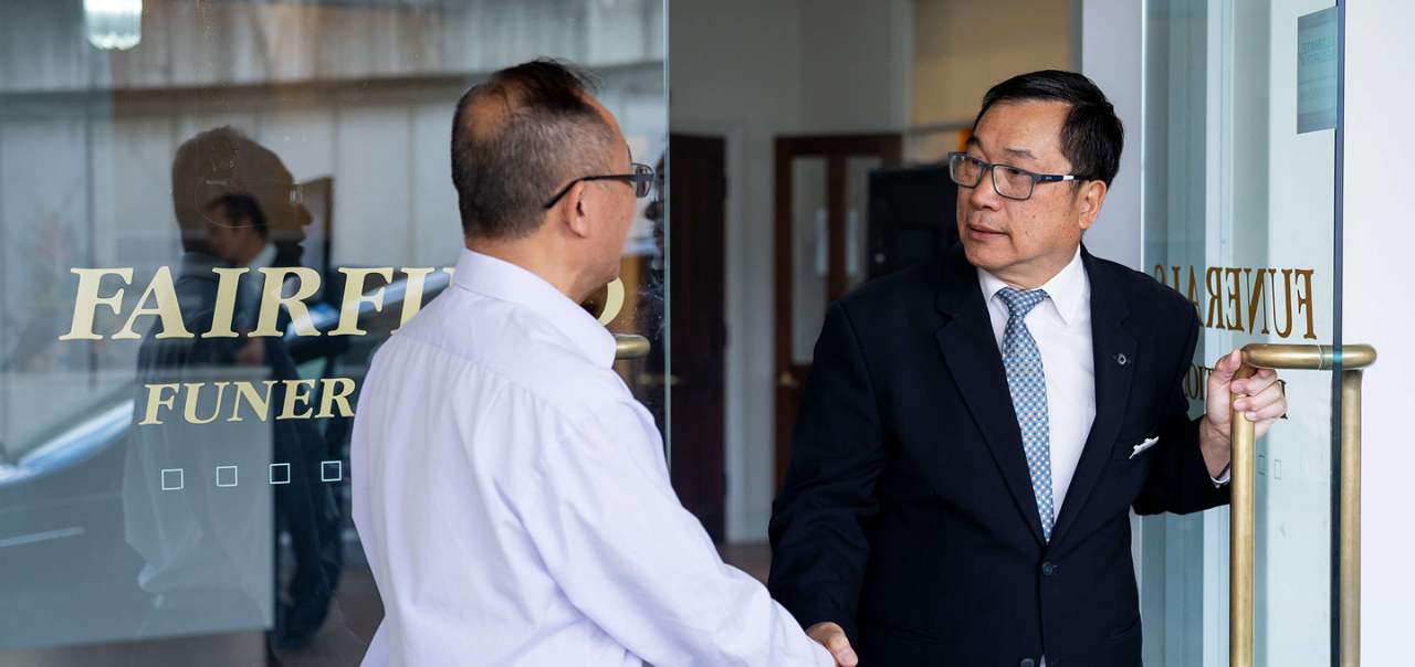 Universal Chung Wah funeral director greeting a man